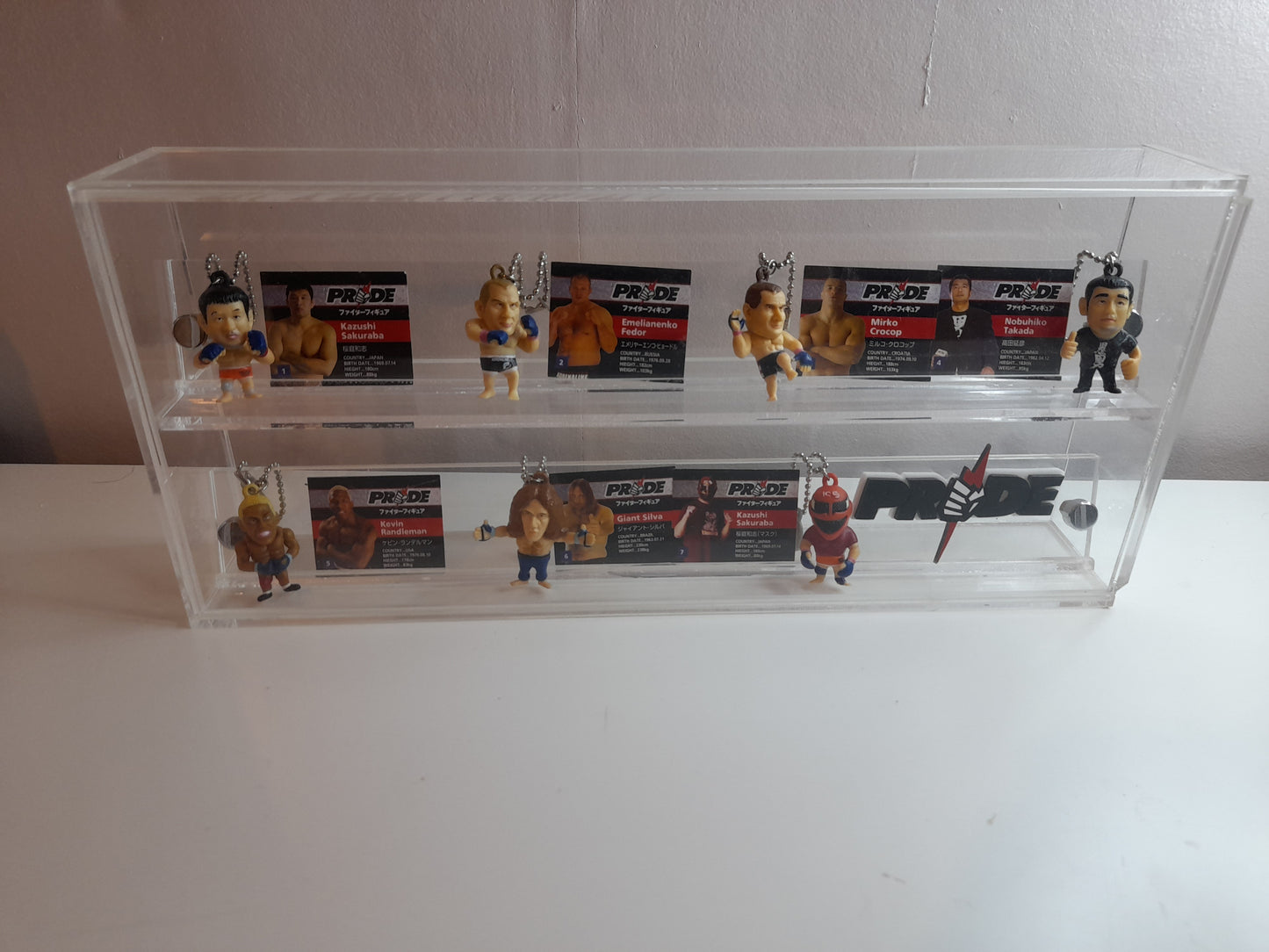 Pride Fighting Championship 7-11 Mini Figure Keychain Set in Display Case with Logo