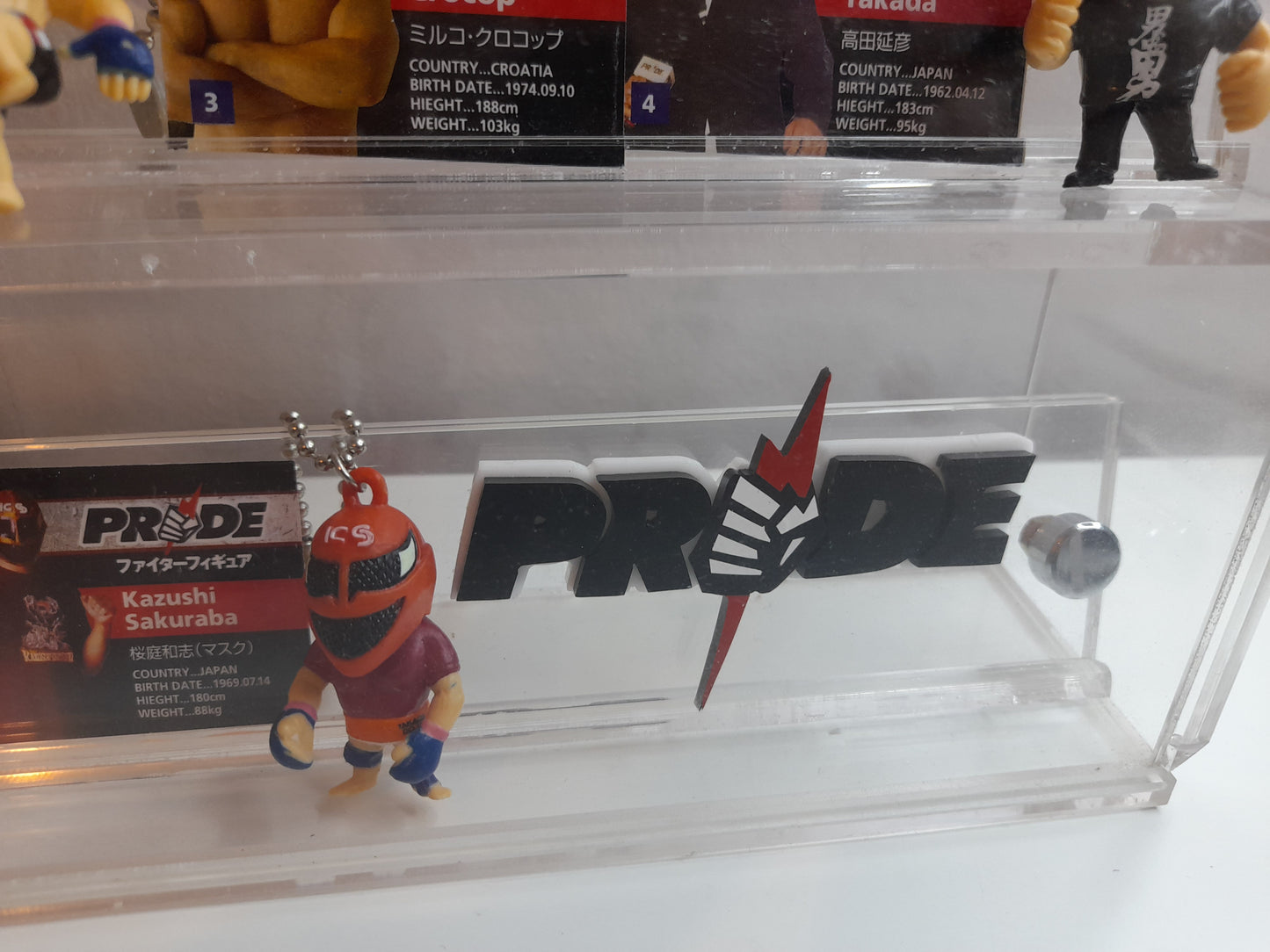 Pride Fighting Championship 7-11 Mini Figure Keychain Set in Display Case with Logo